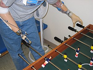 A soldier in the U.S. Army plays fooz-ball wit...