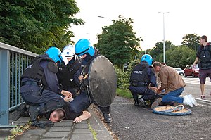 Police arrests protesters in Leuven, Belgium.