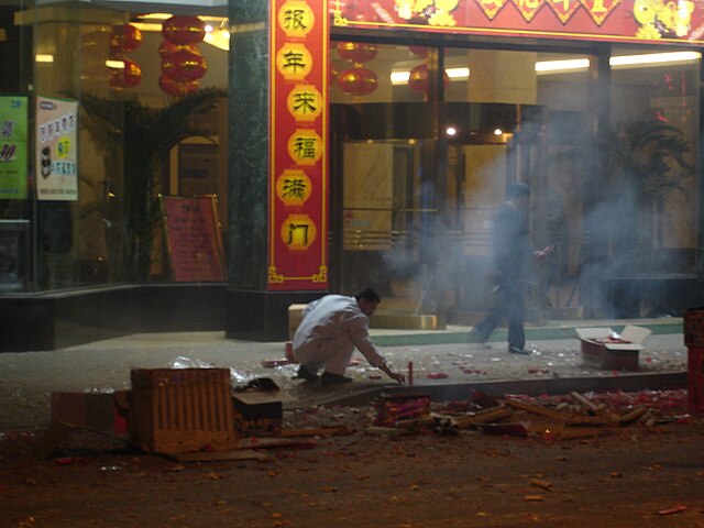 A Chinese man setting off fireworks during Chinese New Year in Shanghai. (6 February 2008)