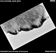 North Polar scarp in Abalos Undae with basal exposure and dunes and distance scale