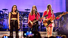 Haim performing in April 2018 From left to right: Alana, Danielle, Este Haim