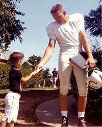 Pro Football Hall of Fame inductee Johnny Unitas was the Baltimore Colts' starting quarterback and famed "Number 19", from 1956 to 1972. Unitas was raised in the Pittsburgh area and played earlier for the University of Louisville in Louisville, Kentucky JohnnyUnitasSignAutograph1964.jpg