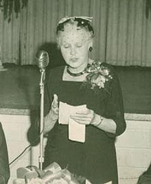 Black and white photograph of Laure Gaudreault reading a speech