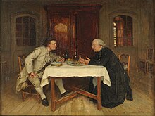 Un homme et un curé, habillés à la mode du XVIIIe siècle, sont en pleine discussion, autour d'une table dressée avec leur repas, dans une pièce.