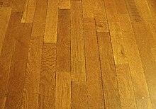 Wood can be cut into straight planks and made into a wood flooring. LightningVolt Wood Floor.jpg