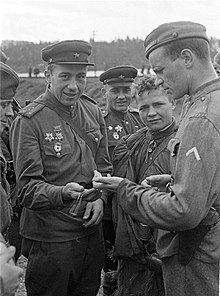 A Soviet (left) and a Finnish officer compare their watches on 4 September 1944 at Viipuri (Vyborg). Officers comparing watches.jpg
