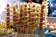 Tornado potatoes with sausages in the middle, sold in Seoul