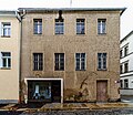 Wohnhaus, Eckhaus mit Ladeneinbau, in geschlossener Bebauung