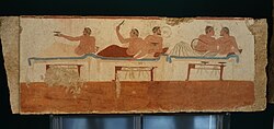 A symposium scene with a pederastic couple. Fresco from the north wall of the Tomb of the Diver. 470 BCE Fresco from the Tomb of the Diver, near Paestum, ca. 470 BCE, Paestum museum (4).jpg