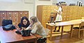 Students exploring library and archive at Nordic museum for Wikipedia editing.