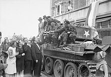 The crew of a Cromwell tank is welcomed by Dutch civilians in Eindhoven, 19 September 1944 The British Army in North-west Europe 1944-45 BU939.jpg