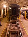 Wheels rolling below an elevated carriage during the wheel changing from Mongolian to Chinese gauge on the Trans-Mongolian Railway