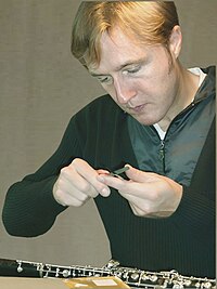Oboist Albrecht Mayer preparing reeds for use.  Oboists scrape their own reeds to achieve the desired tone and response