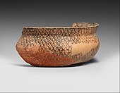 Fragment of a bowl; by Halaf culture from Mesopotamia; 5600-5000 BC; cermaic; 8.2 cm; Metropolitan Museum of Art (New York City)