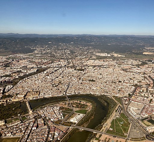 View centered on a city's historic core in description to the Guadalquivir, with Sierra Morena in the background (November 2020)