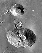 2001 Mars Odyssey THEMIS mosaic of Uranius Tholus (upper volcano) and Ceraunius Tholus (lower volcano). The latter is about as high as Earth's Mount Everest.
