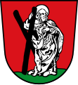 Markt Teisendorf In Rot auf grünem Boden stehend der silbern gekleidete heilige Andreas, der mit der Rechten ein schräges schwarzes Kreuz hält.