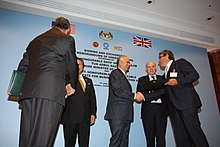 Najib meeting British Secretary of State for Business, Innovation and Skills Vince Cable in London, 13 July 2011 Exchanging Memorandum of Understandings (5933224531).jpg