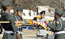 A United States Army Reserve Command Honor Guard sergeant drills high school students at Jackson High School in Georgia, US. Master Sgt. Libby Lipscomb, a member of the Army Reserve Command Honor Guard, evaluates a high school honor guard.jpg