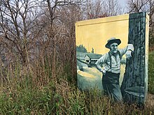 A painting of lumbermen on an electrical box in Menomonie, Wisconsin.