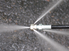 Drain and Sewer Jetter Spray Nozzle close up with water flow