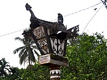 Sandung of Dayak Pesaguan people in Ketapang Regency, West Kalimantan. Note a sculpture of a dragon above it Sandung 101013-7585 mp.JPG