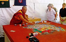 Tibetan Buddhist Sand Mandala Tibetan Monk creating sand mandala. Washington, DC.jpg