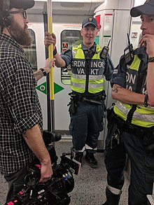 Swedish ordningsvakt in the Stockholm metro Tunnelbanan.jpg