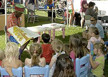 Wally Amos reading to children during Springfest at Naval Station Pearl Harbor, 2007 US Navy 070421-N-1280S-001 Wally Amos, founder of Famous Amos Cookies takes children on a reading adventure during Springfest.jpg