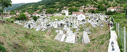 Панорамски поглед на црквата и селските гробишта со дел од селото