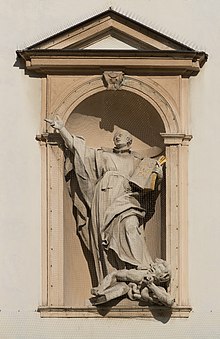 A statue in Vienna portraying Saint Ignatius of Loyola trampling on a heretic AT-119587 Fassadendetails der Jesuitenkirche in Wien -hu- 8947.jpg