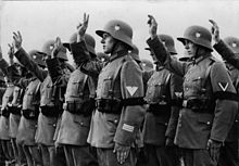 German Reichswehr soldiers wearing WW1 Stahlhelme, but with the new insignia Bundesarchiv Bild 102-16108A, Vereidigung von Reichswehr-Soldaten auf Hitler.jpg