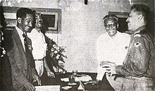 M.S. Rumagesan, Silas Papare, N.L.Suwages, Soegoro Atmoprasodjo [id], and A.H. Nasution in Putra-putra Irian Barat ('Sons of Irian Barat') Conference in Cibogo Bogor, 14-15 April 1961 MS Rumagesan, Silas Papare, NL Suwages, Sugoro, dan AH Nasution berbincang-bincang, Konferensi Cibogo.jpg