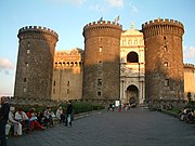 The Castel Nuovo ("New Castle") was renovated and chosen as his palace by Charles I of Anjou. The entrance is decorated by a Renaissance Arch of Triumph celebrating the entrance in the city of the Aragonese king Alfonso I (15th century)