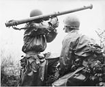 An American 2.36-inch bazooka team takes aim at a North Korean tank during the Battle of Osan.