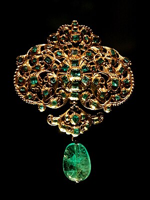 Gold, set with table-cut emeralds, and hung wi...
