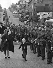 The BC Regiment marching in New Westminster, 1940. This image is called "Wait for me daddy".