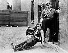 Buster Keaton (left) and Joe Roberts in the movie Neighbors (1920).jpg