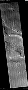 Wide view of honeycomb shapes and possible dikes that make an "X" shape, as seen by HiRISE under HiWish program