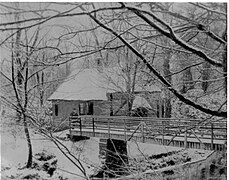 Lady Jane's cottage with its footbridge across the Lugton Water.