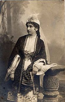 Old photo of a standing woman