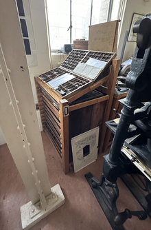 A type cabinet showing an upper case and a lower case of Ehrhardt type in the HPR Historical Printing Room at the Cambridge University Library.png