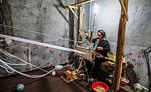 Woman weaving Jajim on a loom