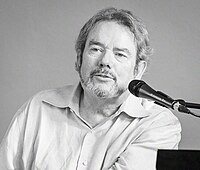 A black and white photo of the track's writer and producer, Jimmy Webb.