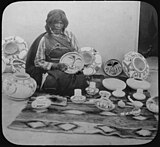 Iris Nampeyo, world-famous Hopi ceramist, with her work, c. 1900, photo by Henry Peabody