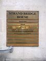 Plaque outside old office at Strand Bridge House