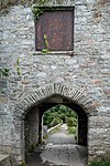 Archway of the Grade II listed Radford Castle folly in Plymstock, Plymouth