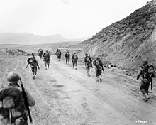American troops moving through the Kasserine Pass Americains Kasserine.jpg