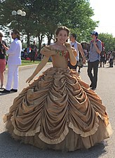 A cosplayer as Belle from Beauty and the Beast.