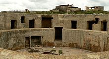 Gun emplacement in Fort Campbell, built in the 1930s. Due to the threat of aerial warfare, the buildings were placed at a distance from each other, making it difficult to find from the air. Fort Campbell 09.jpg